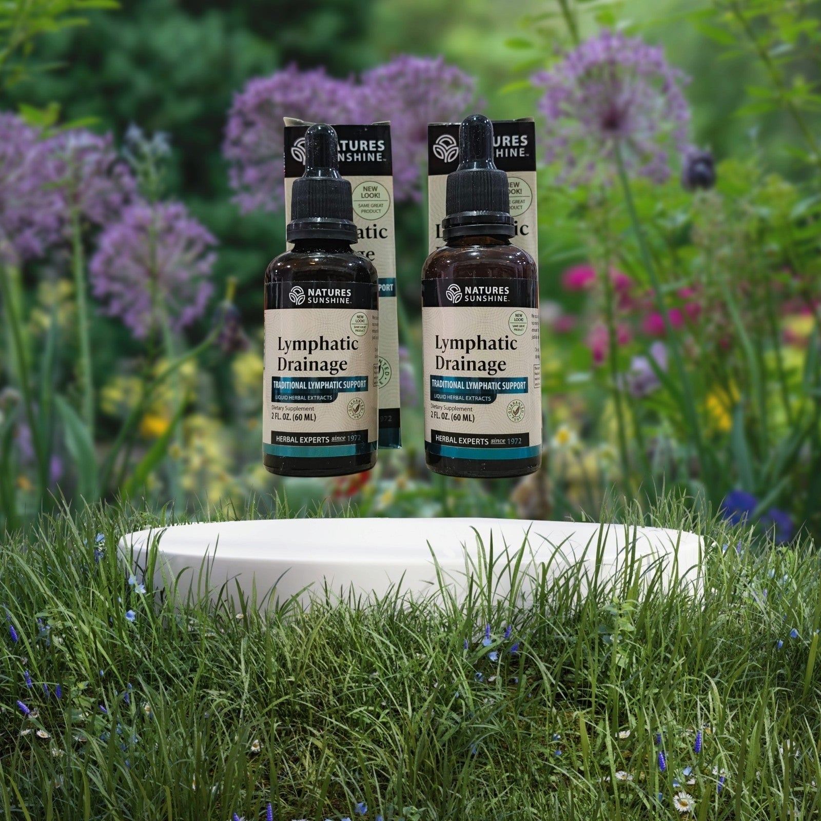 Dos frascos de suplemento herbal Lymphatic Drainage de Mi tienda con gotero para apoyo del sistema linfático.