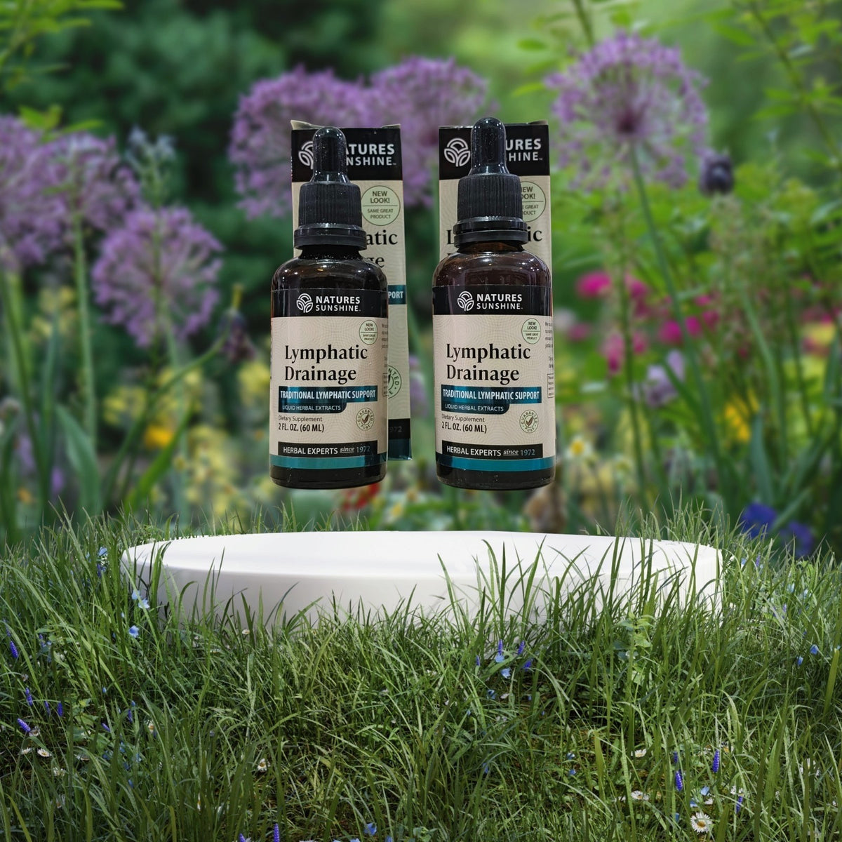 Dos frascos de suplemento herbal Lymphatic Drainage de Mi tienda con gotero para apoyo del sistema linfático.